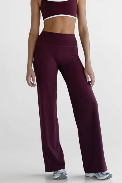 Cropped front view of the high-waisted Leelo Sculpt Wide Leg Pants in Cherry Cola, highlighting the smooth front and seamless tapered waistband.