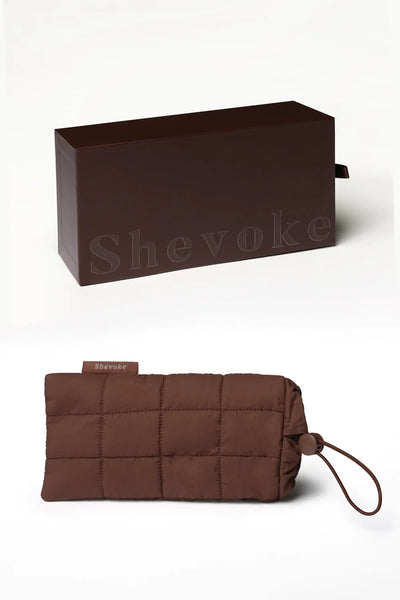 Product packaging shot featuring the dark brown SHEVOKE hard case box above a matching brown quilted fabric drawstring pouch.