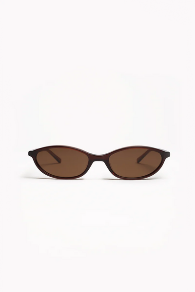 Front view of Shevoke Zulu polarised sunglasses showcasing slim, oval crystal brown acetate frames with light brown tinted lenses.