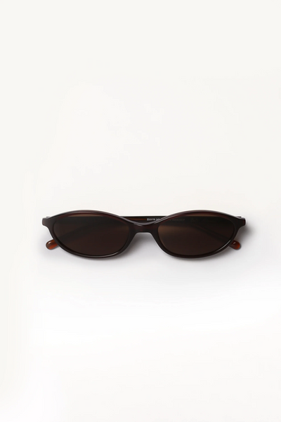 Direct front product shot of Shevoke Zulu oval crystal brown acetate sunglasses with dark polarised lenses.