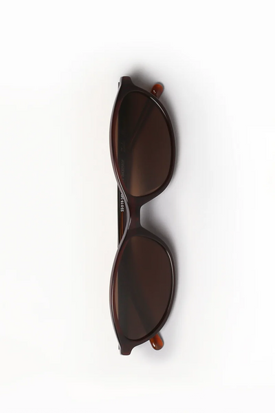 Top-down view of Shevoke Zulu crystal brown acetate sunglasses folded flat, showing the inner temple arm frame measurements.