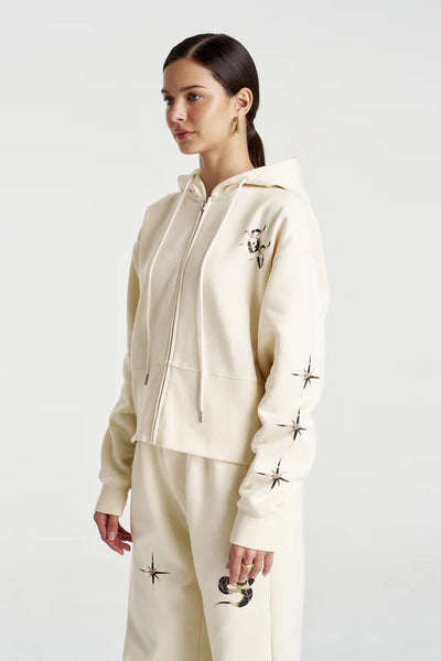 Rear view of the Motif Hoodie in Vanilla, showcasing the clean, expansive back and the generous volume of the relaxed hood.