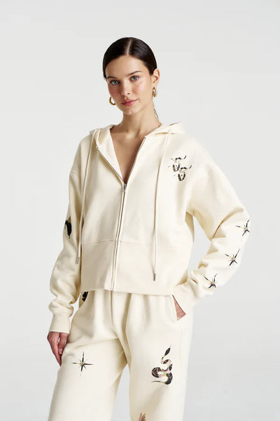 Model wearing the Motif Hoodie, illustrating the effortless "off-duty" oversized fit and the slouchy, dropped shoulder design.