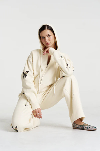 Model wearing the Motif Hoodie, illustrating the effortless "off-duty" oversized fit and the slouchy, dropped shoulder design.