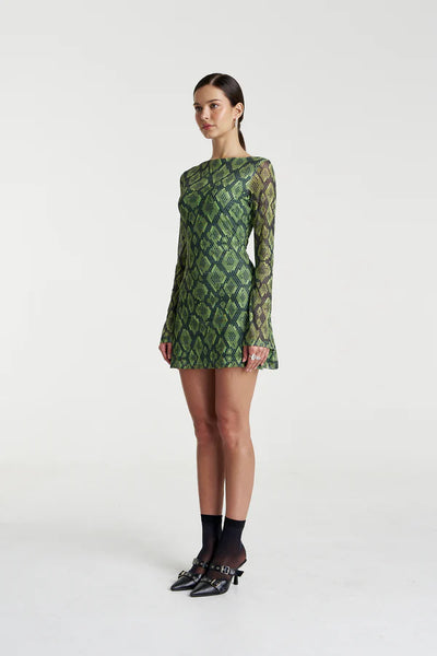 A rear view of the Hibernate Mini Dress in Viper, illustrating the high neckline, seamless back pattern, and clean mini-length hemline.