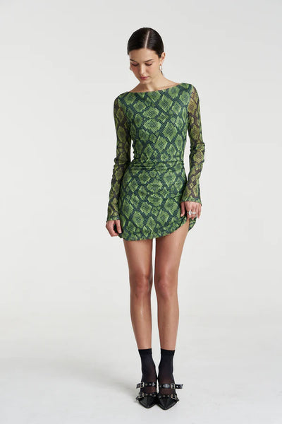 A full-length view illustrating the mini dress's structured A-line silhouette and the comfortable, stretchy drape of the polyester-spandex mesh.