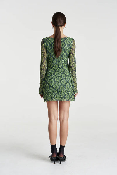 Back profile highlighting the consistent sheer mesh fabrication across the shoulders and the structured flare of the A-line skirt.