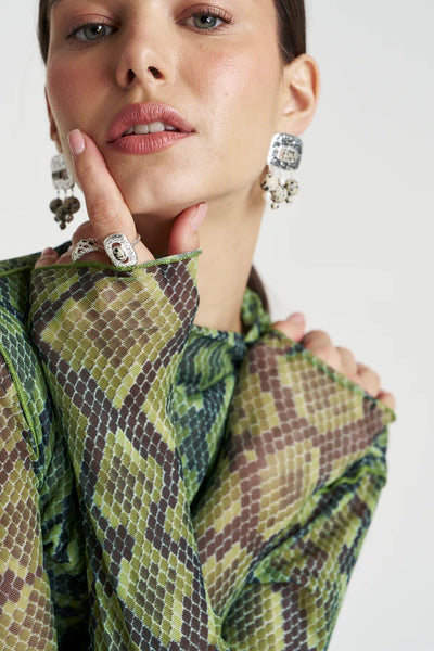 A tight close-up on the neckline and shoulder, detailing the fine weave of the Viper mesh fabric and the depth of the neon green and dark brown reptile scales.