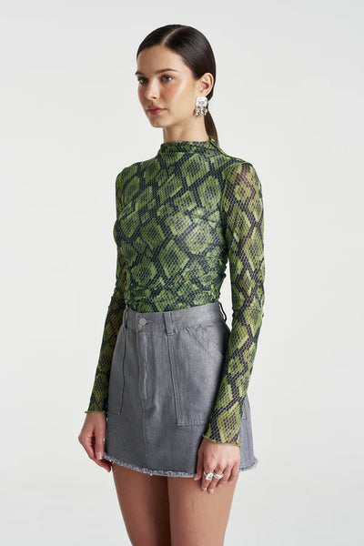 A three-quarter angle of the Viper Mesh top, highlighting the body-con fit and how the sheer green snake print layers over the skin.
